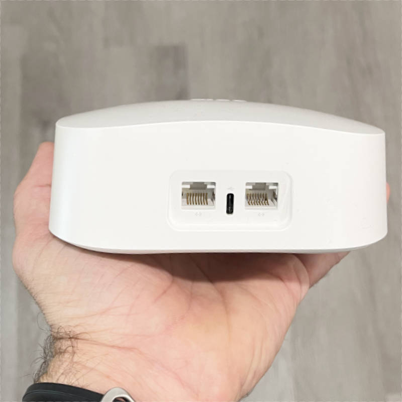 eero Pro 6 in hand showing the ports in the back view