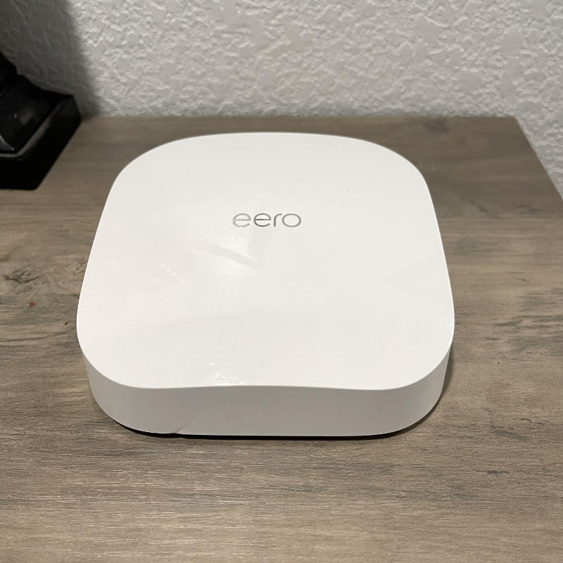 eero Pro 6 on desk - front view